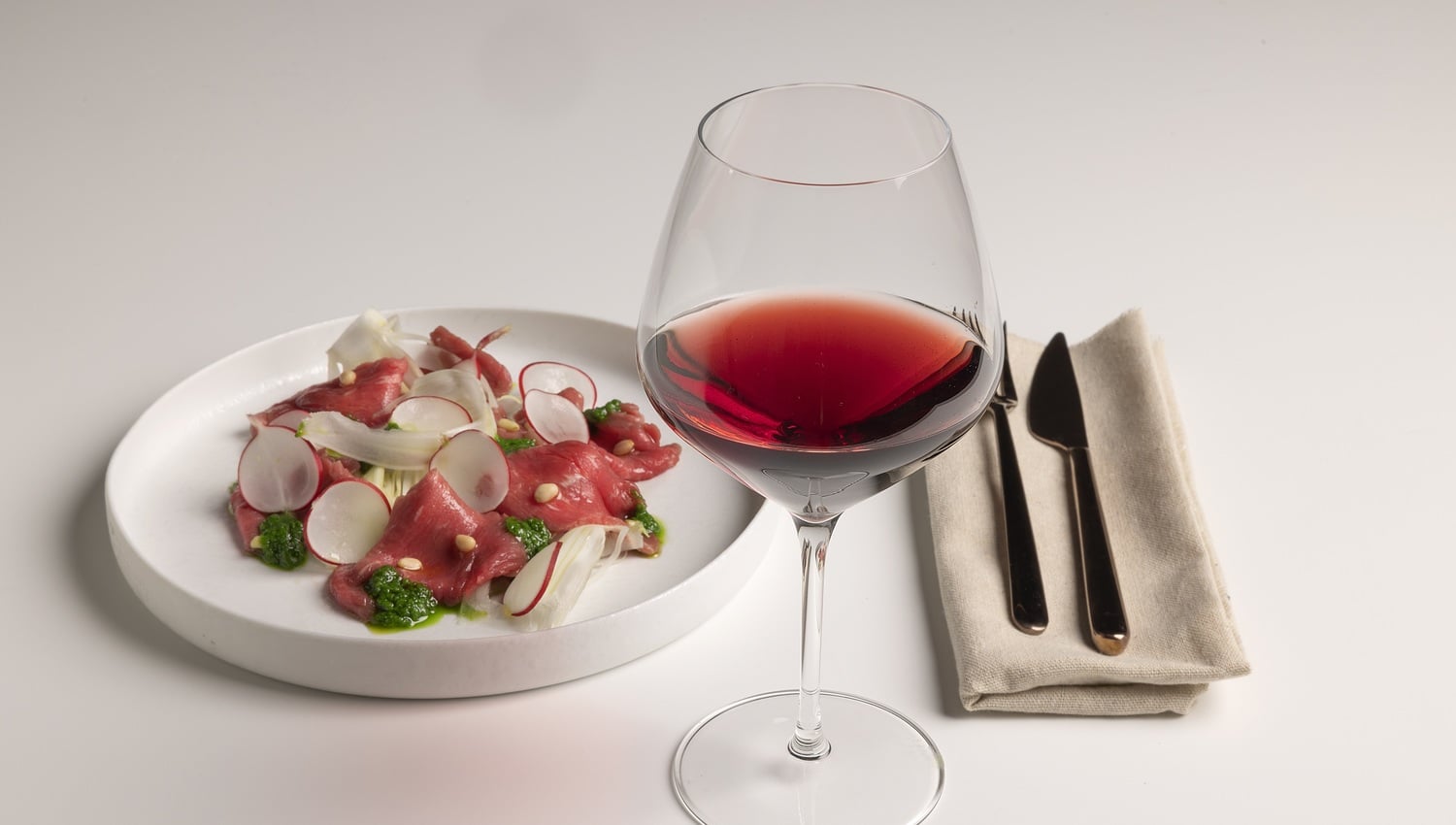 Beef carpaccio, crunchy fennel and rocket pesto