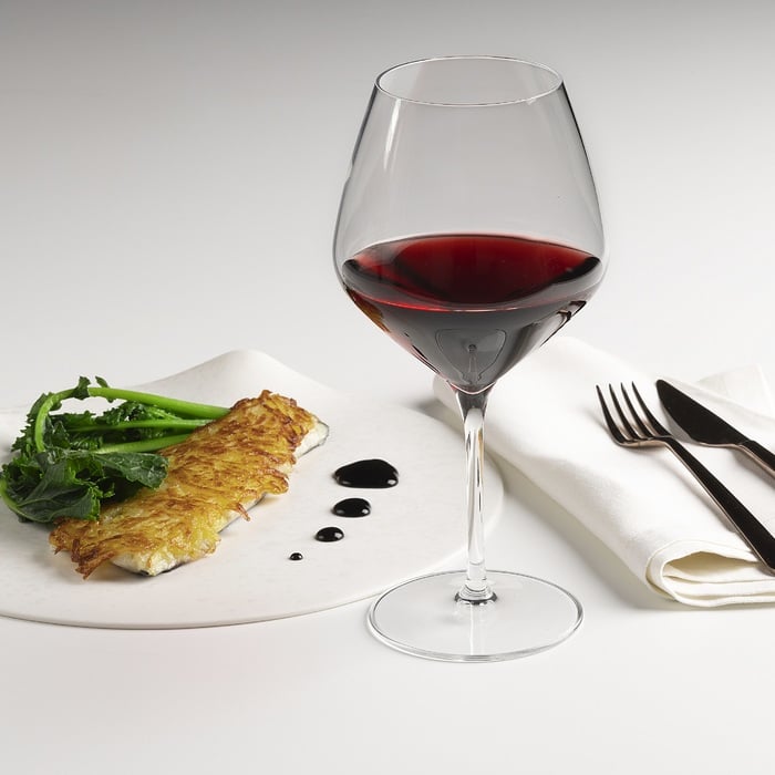 Bass filet with potato crust, red wine reduction and broccoli rabe