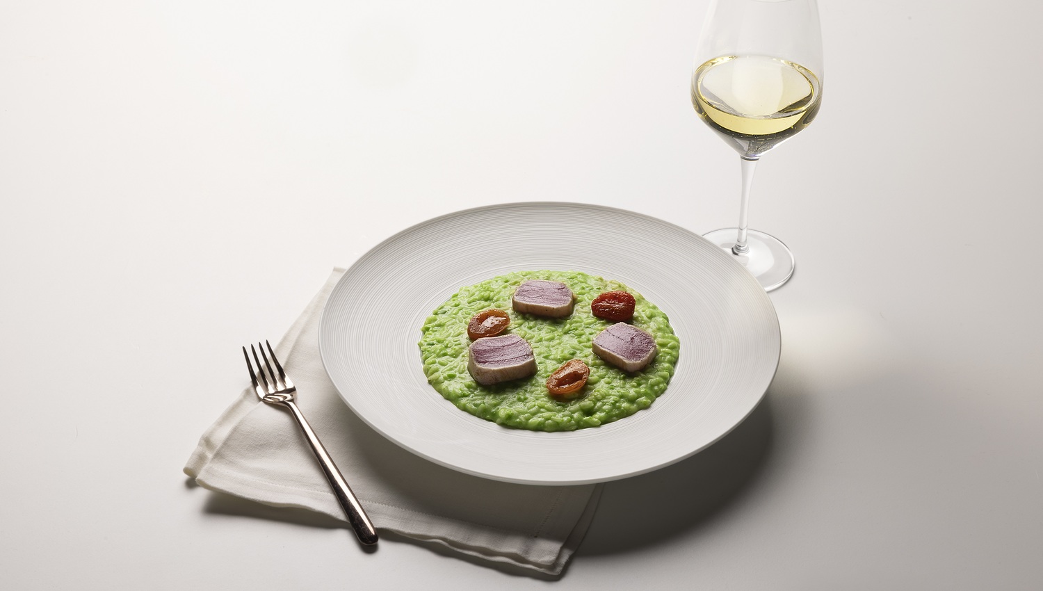Risotto with pea cream, seared tuna and cherry tomato confit